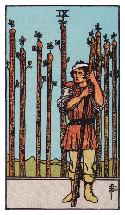 La carte Neuf de Bâtons du tarot Rider-Waite